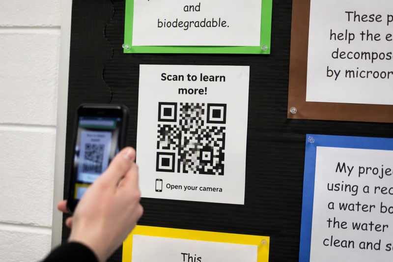 13 Creative Pin Board Ideas for Classroom Organization 8 8. Digital-Hybrid QR Code Display